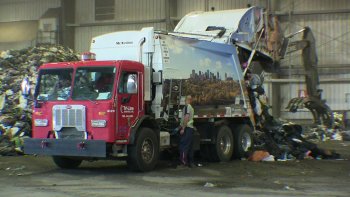 The process begins with garbage trucks dumping their loads of municipal solid waste on the tipping floor at the Integrated Processing and Transfer Facility